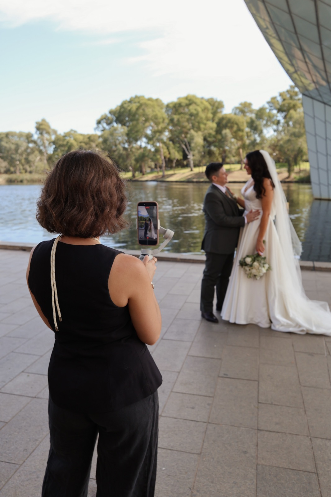 A wedding couple at Adelaide's Riverbank, captured candidly by Once Content